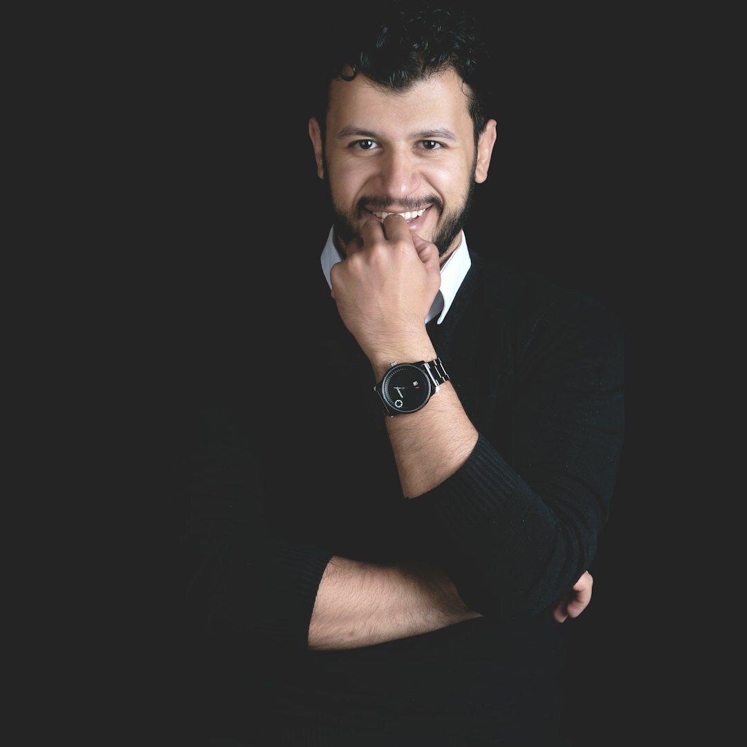 Professional Belgian man smiling in business casual attire